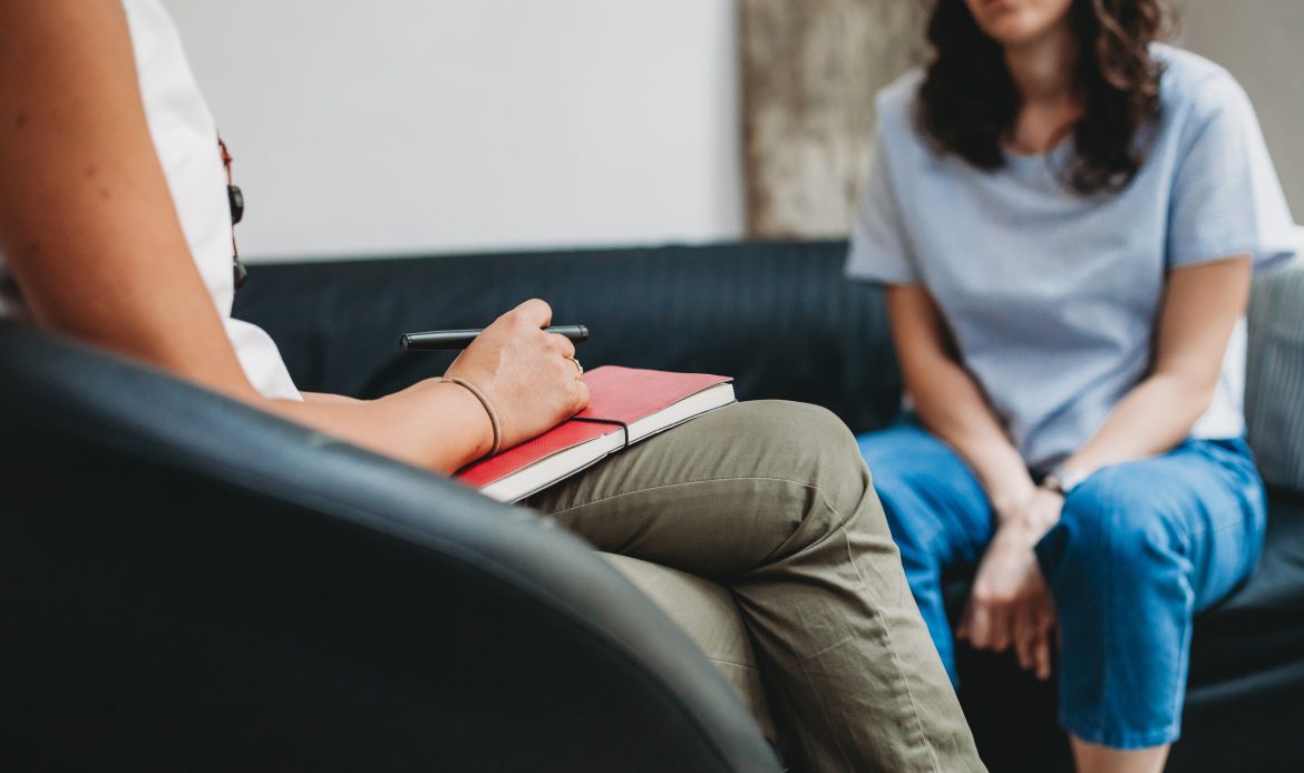 Psychotherapy session, woman talking to his psychologist at Mentally STRONG