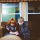 Two women sharing a moment of quiet support, showing that grief is love with nowhere to go.