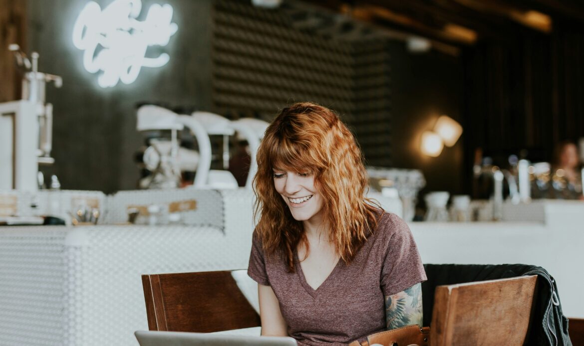 Person working on a laptop in a relaxed environment