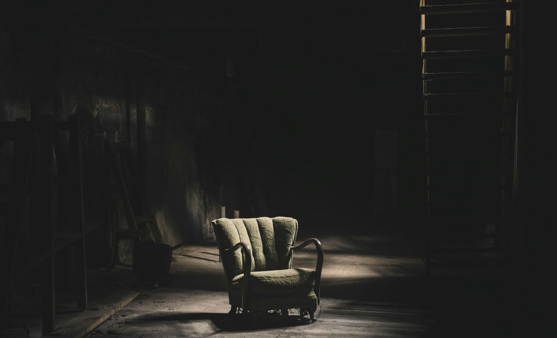 Empty room with a single chair representing feelings of emptiness, a common symptom of quiet BPD."