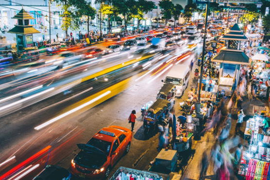 Busy city street at night, reflecting how being constantly occupied can be tied to delayed grief.