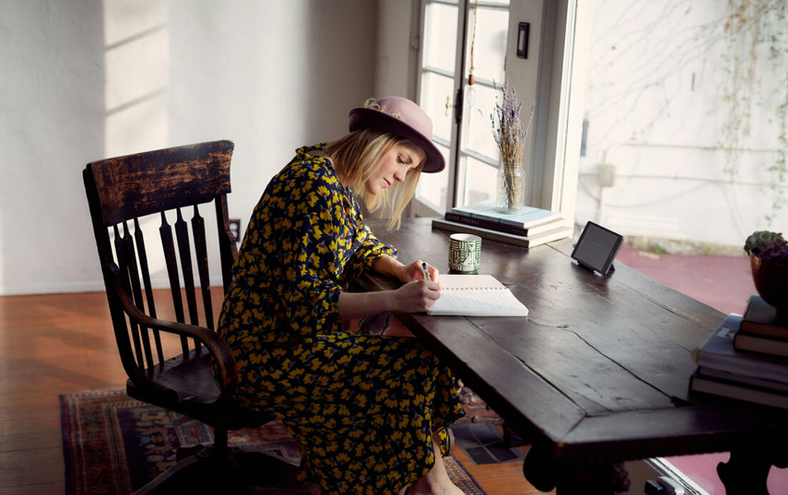 Person using grief worksheets for personal healing and reflection.