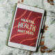 A tablet displays the words "Mental Health Matters" on a red background, representing the importance of setting and achieving mental health goals.