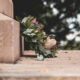 A floral wreath placed on stone steps, symbolizing remembrance and honoring a loved one on their one-year death anniversary.