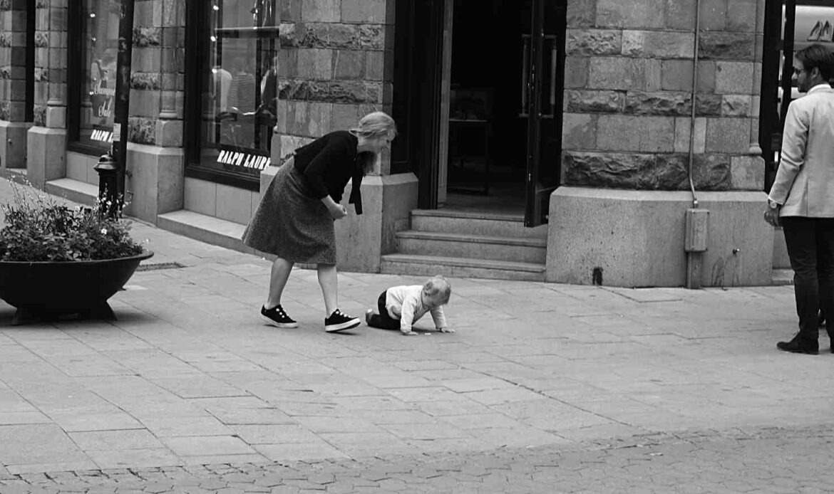 Toddler sitting on outdoor stone steps