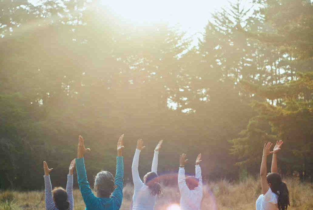 Group of people raising hands