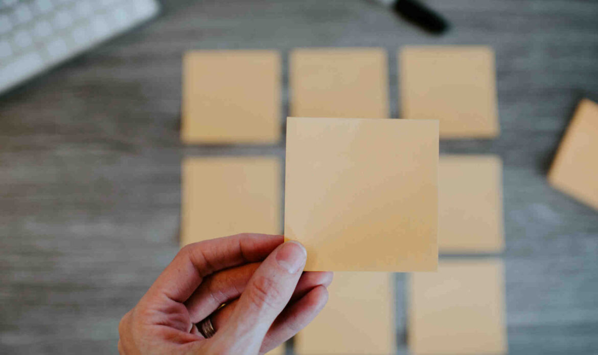 Hands holding blank white paper