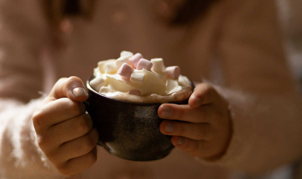 Person holding a bowl of food