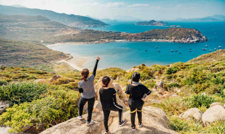 Three women on a mountain summit