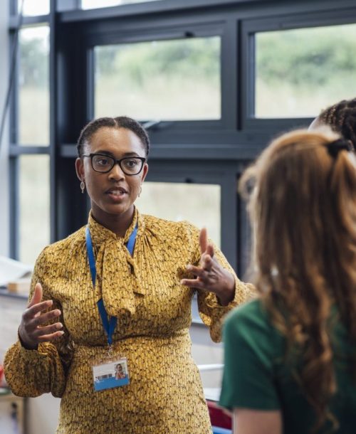 Professional woman discussing how to join the Mentally STRONG team.