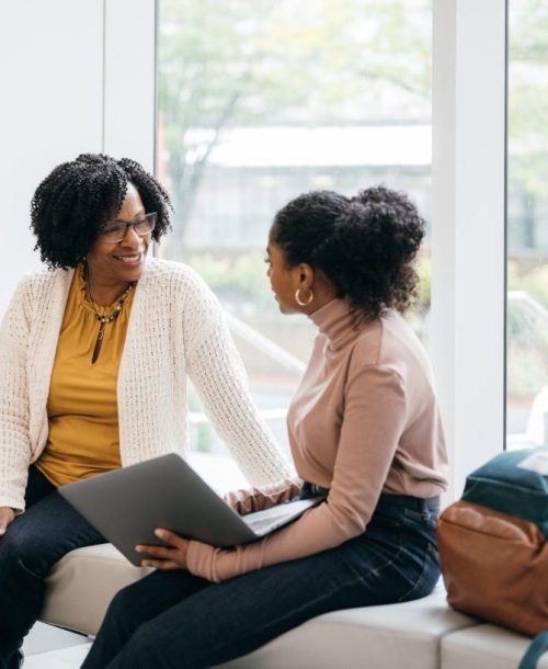 Two women discussing a mental health referral.