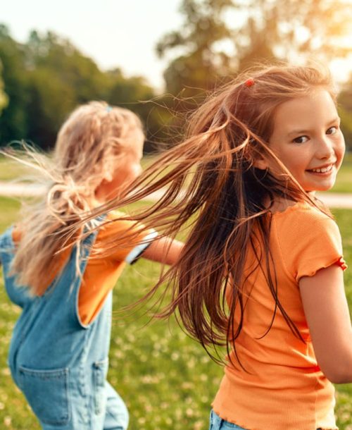 Raising mentally strong kids: children enjoying a sunny day.